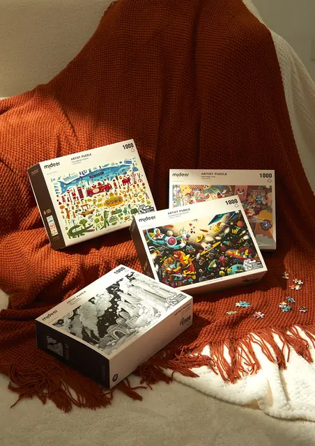 mideer artist jigsaw puzzle boxes on a blanket